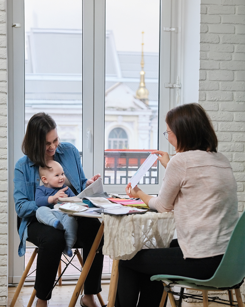 Maternity nurse examining an expectant mother at home